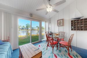 a living room with a table and chairs and a couch at Mallard Lakes 158 Cardinal Ln in Selbyville
