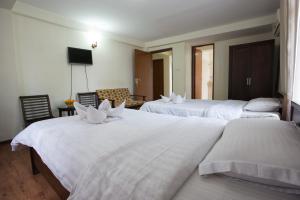 Ένα ή περισσότερα κρεβάτια σε δωμάτιο στο Hotel Yambu kathmandu
