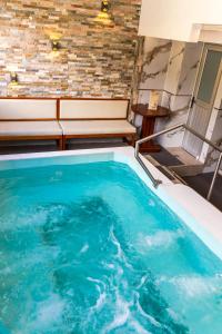 a swimming pool in the middle of a room at Xperience Hotel in Baños