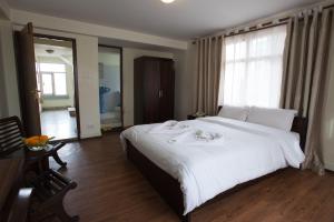 Ένα ή περισσότερα κρεβάτια σε δωμάτιο στο Hotel Yambu kathmandu