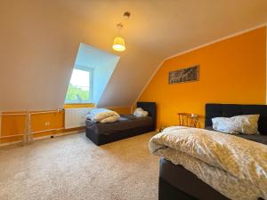 a bedroom with two beds and a window at Modern Stay Apartments in Kassel