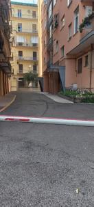 a red and white curb on a street with buildings at PETER PAN apartment in Salerno