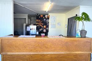 a wooden counter top in a room with a refrigerator at Williamston Inn NC Near Greenville US 64 in Williamston +25 photos