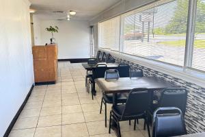 a row of tables and chairs in a waiting room at Williamston Inn NC Near Greenville US 64 in Williamston