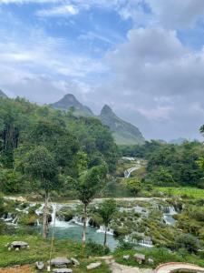 a view of a river with trees and waterfalls at Thàng Khám homestay in Lũng Giên