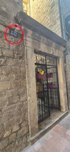 a red frisbee is on the side of a building at Tetka Guest House in Kotor