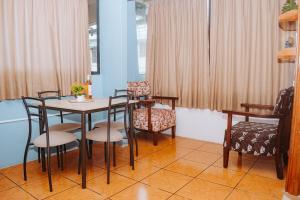 a dining room with a table and chairs at #5 Mini Suite, Cerca de Todo, 2-3 people - AC in Puerto Ayora