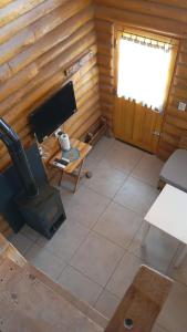 a room with a computer and a desk and a window at Finca La Vilina - Tiny House in San Rafael