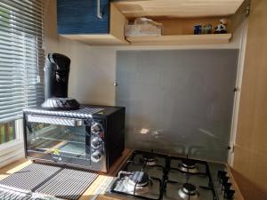 a kitchen with a toaster oven next to a stove at Schatzele in Boofzheim