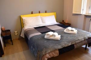 a bedroom with a bed with towels on it at B&B Casale in Avellino