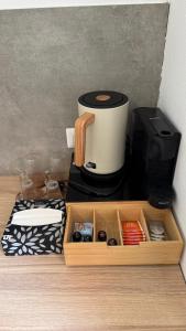 a coffeemaker sitting on top of a coffee maker at B&B Mavi in Como +6 photos