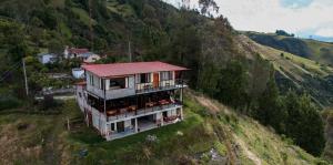 a house on the side of a hill at Inti Amanta Lodge in Sigchos +69 photos