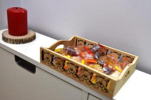 a box of candy on a table with a red candle at B&B Casale in Avellino