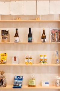 a shelf full of bottles in a store at Priyado Kochi in Kochi