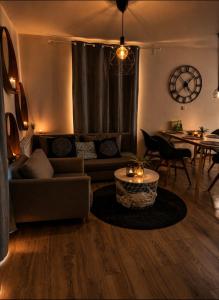 a living room with a couch and a table at Casa NICOLE in Malá Morávka