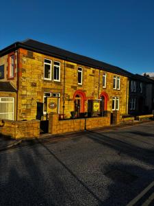 a brick building on the side of a street at Hamilton House Guest House in Oban