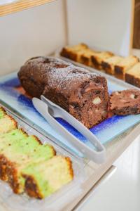 a tray with several different types of bread and pastries at BeB Villa Pacifica in Peschici +32 photos