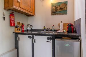 a kitchen with a counter top and a sink at The Stables in Kampen