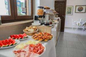 a buffet with several plates of food on a table at BeB Villa Pacifica in Peschici