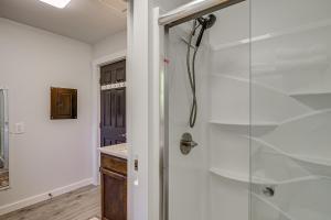 a bathroom with a shower with a glass door at Pet-Friendly Quaint Cottage: Park-Like Setting in Monroe