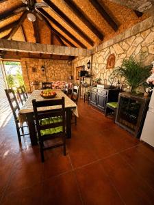 a kitchen with a table and chairs in a room at Vila Angel in Bečići