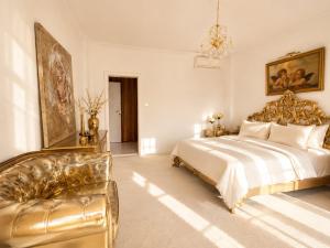a large bedroom with a bed and a couch at Vila Angel in Bečići +11 photos
