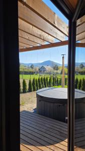 a view from the porch of a house with a patio at Lipowe Love in Lipowa +8 photos