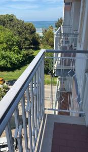 a balcony of a house with a view of the ocean at BradAmare Seafront in Montesilvano