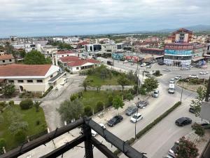 an aerial view of a city with cars on a street at Gorenje apartment in Fier