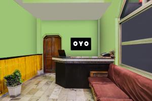 an office with a desk with aype sign on the wall at Super Hotel O by OYO Kavish Residency in Haridwār +26 photos