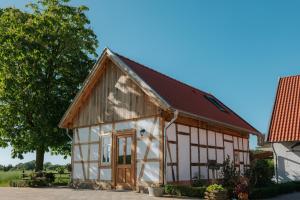 a small house with a brown roof at Ferienhaus am Dillbach in Hagen