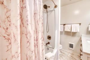 a bathroom with a pink marble shower curtain at Bamboo House - Meredith Lodging in Nehalem +36 photos
