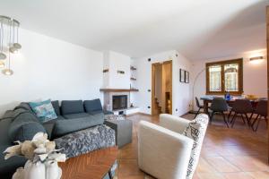 a living room with a couch and a table at Casa dei Galli in Gravedona +34 photos
