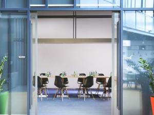 a conference room with a table and chairs at Ibis Styles Dubai Jumeira in Dubai +99 photos