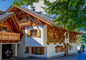 a building with wooden balconies and windows on it at Ferienwohnung Wiagsog in Garmisch-Partenkirchen