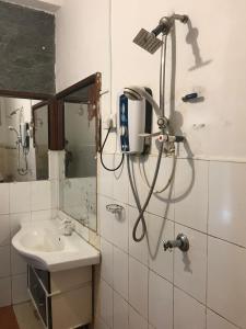 a bathroom with a shower and a sink at Linwood Bungalow in Kandy +65 photos