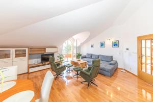 a living room with a couch and a table at Apartmani Villa Biočić in Split