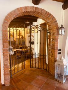 an entry gate to a dining room with a table at Bed And Breakfast Olimpia in San Salvatore Monferrato +62 photos
