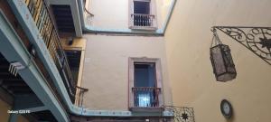 an overhead view of a building with two balconies and a window at Hotel Republica in Mexico City