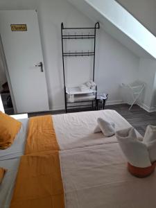 a bedroom with a large white bed in a attic at Flexygere 2 in Orléans