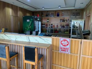 a bar with two chairs and a no staff only sign at Perch Hotel & Suites in Lagos