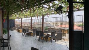 a restaurant with tables and chairs and a view of the city at Perch Hotel & Suites in Lagos +9 photos
