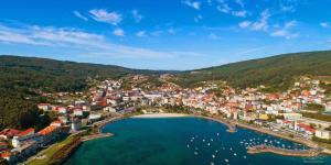 an aerial view of a town with a large body of water at Abuela Maruja - Piso acogedor en Cee, perfecto para desconectar in Cee