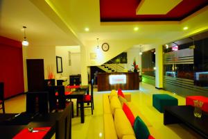 a living room with a couch and a table at City Stay in Galle