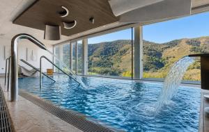 a swimming pool with a view of a mountain at Arantza Hotela - Boutique Hotel "Adults Only" in Arantza