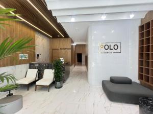 a lobby with a poda sign on the wall at Sea Breeze Polo in Nardaran +31 photos