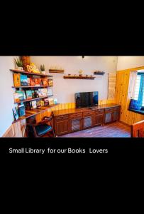 a large room with a large library for our books lovers at The Aalayam in Mukteshwar