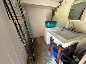 a bathroom with a sink and a toilet at L'Oustalou de Petit Jean in Cassaniouze