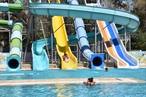 a group of people in the water at a water park at Hôtel Hammamet Beach in Hammamet +21 photos