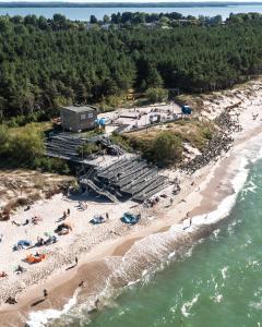 an aerial view of a beach with people on it at Holiday Golden Resort & Spa in Łazy